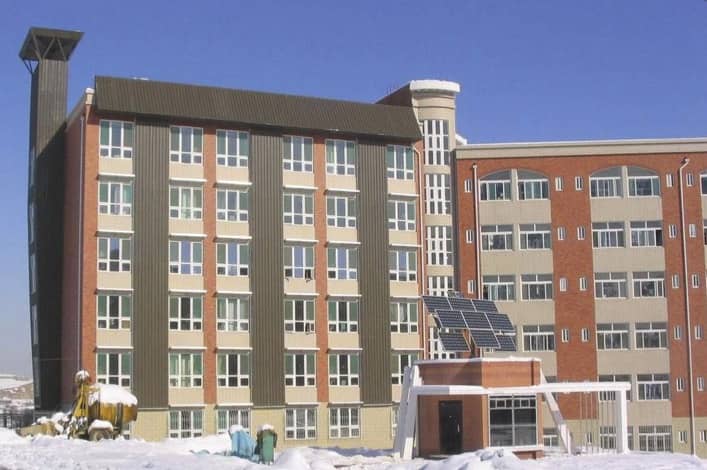 Figure 1.  A ‘green’ wing to a dormitory on Shandong Jianzhu University’s campus demonstrates technologies that improve building environmental performance